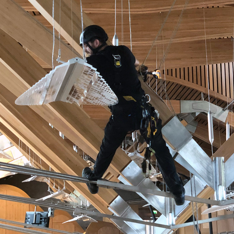 TRAC technician conducting building maintenance