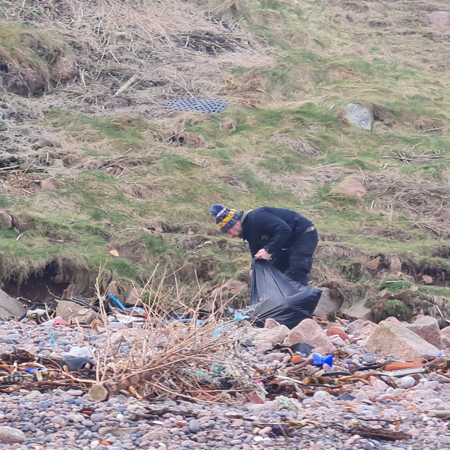 HLM member conducting a litter pick at the beach